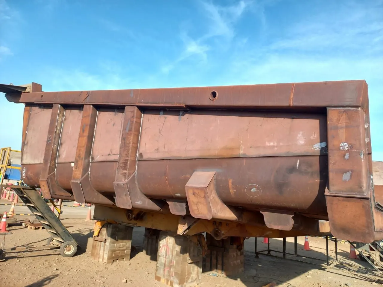 Shell of a mining truck body on supports